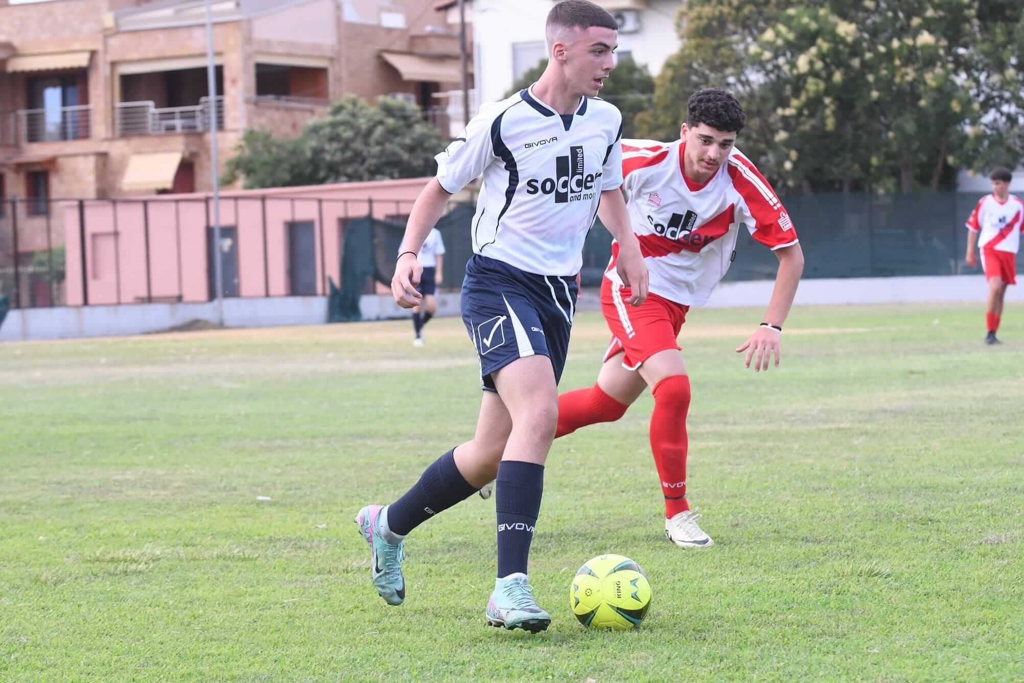 A competitive football match at SoccerX Camp