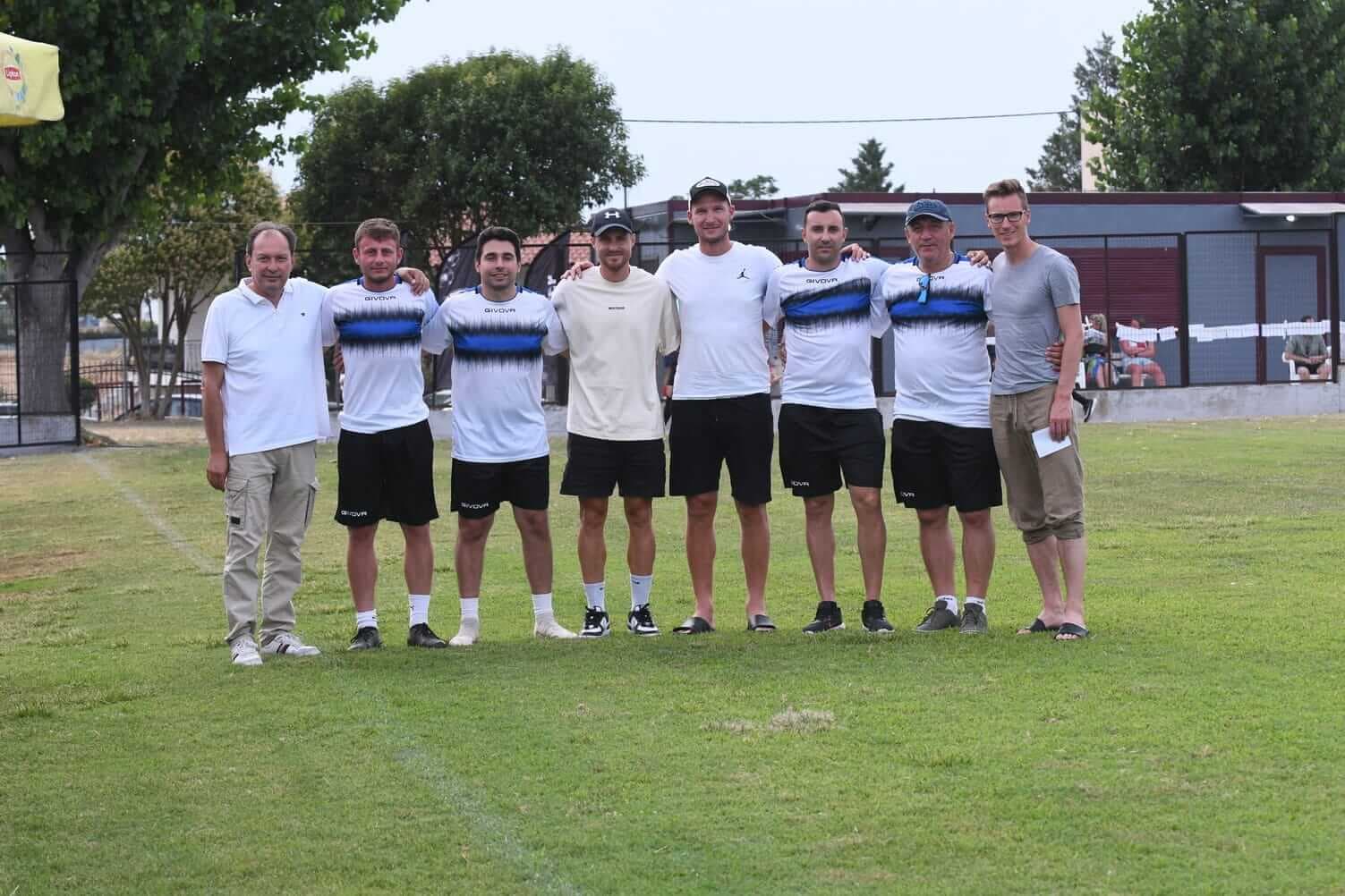 The SoccerX Camp team beside the football pitch